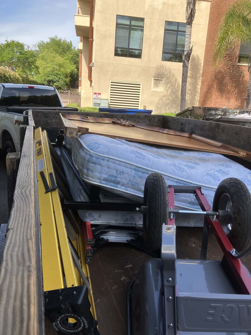 Junk Removal Northridge trailer loaded with a mattress